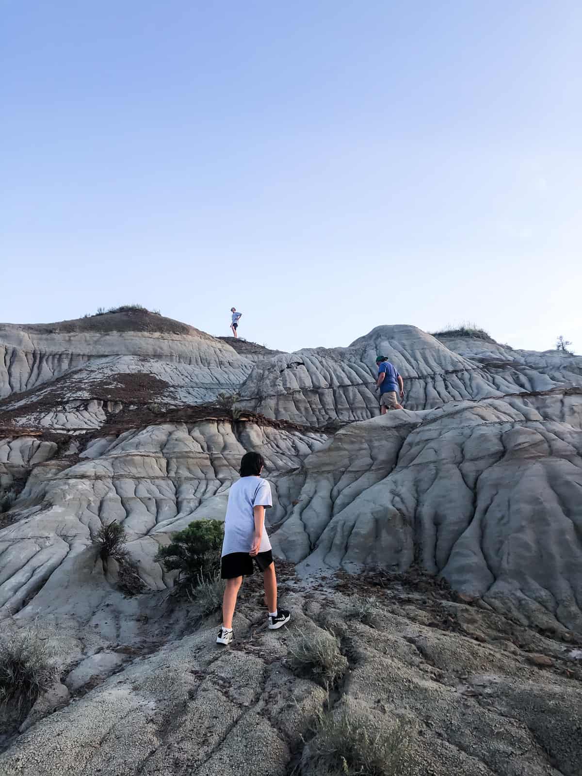 Kids climbing hoodoos