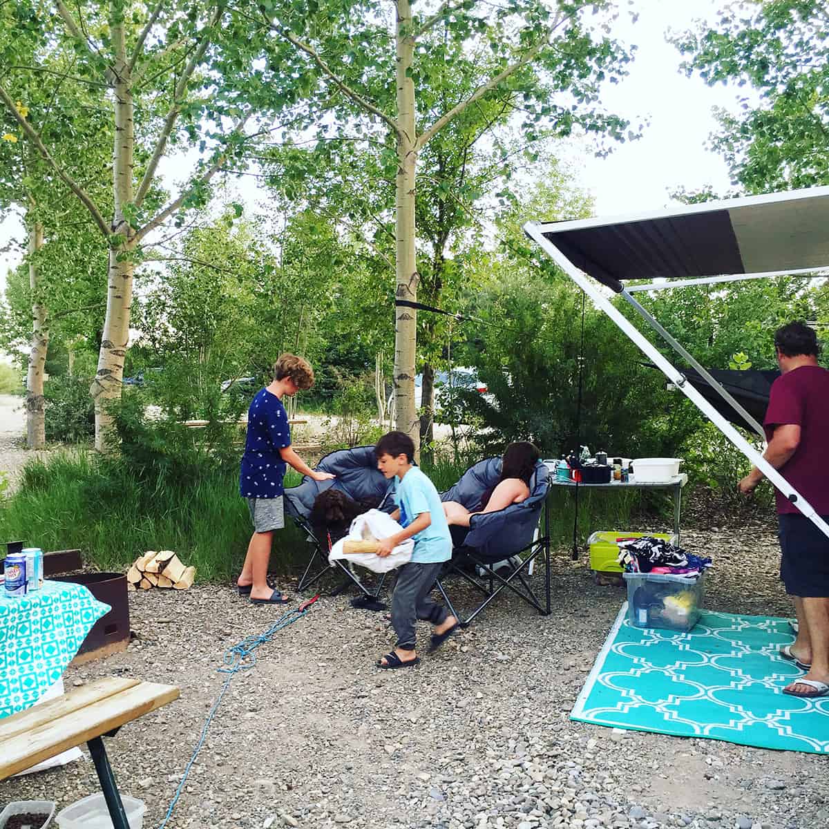 an image of a family in a campsite